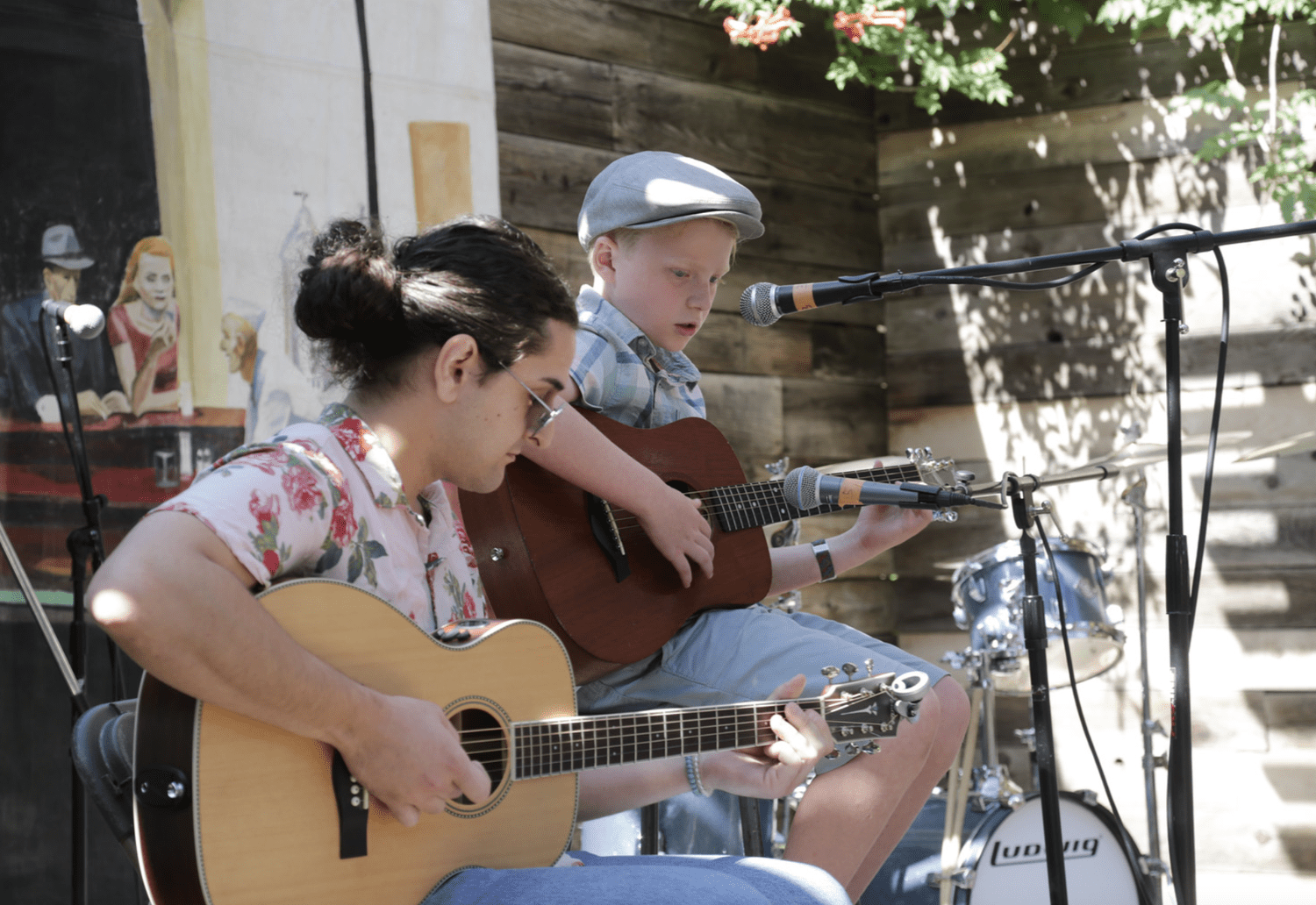 Students playing acoustic guitar
